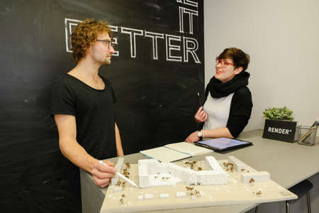 MINSK, BELARUS - February 25, 2020: young architects discussing in office about projectのeditorial素材