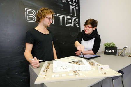 MINSK, BELARUS - February 25, 2020: young architects discussing in office about projectのeditorial素材