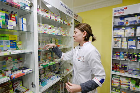MINSK, BELARUS - February 25, 2020: pharmacist in a night pharmacyのeditorial素材