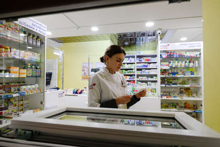 MINSK, BELARUS - February 25, 2020: pharmacist in a night pharmacyのeditorial素材