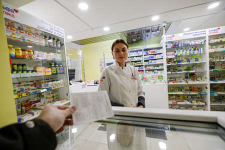 MINSK, BELARUS - February 25, 2020: pharmacist in a night pharmacyのeditorial素材