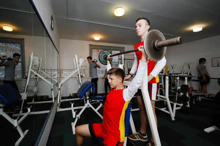 MINSK, BELARUS - February 25, 2020: teenagers are engaged in bodybuilding in the gymのeditorial素材