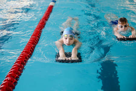 MINSK, BELARUS - February 25, 2020: children learn to swim in the poolのeditorial素材