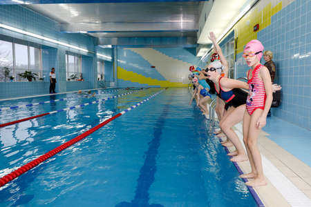 MINSK, BELARUS - February 25, 2020: children learn to swim in the poolのeditorial素材