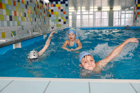 MINSK, BELARUS - February 25, 2020: children learn to swim in the poolのeditorial素材