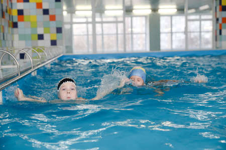 MINSK, BELARUS - February 25, 2020: children learn to swim in the poolのeditorial素材