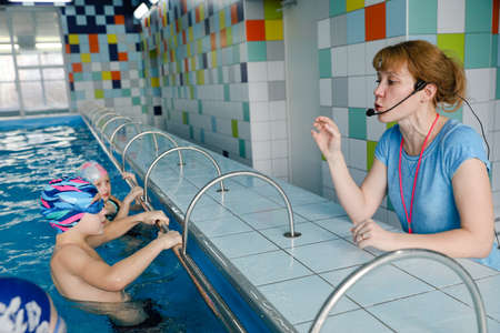 MINSK, BELARUS - February 25, 2020: children learn to swim in the poolのeditorial素材