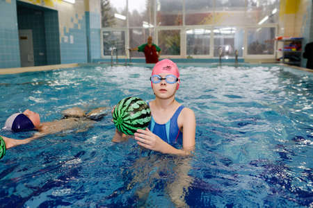 MINSK, BELARUS - February 25, 2020: children learn to swim in the poolのeditorial素材