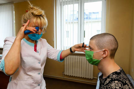 MINSK, BELARUS - 1 MARCH, 2020: draftees undergo a physical examination and go to serve in the army during the coronavirus pandemicのeditorial素材