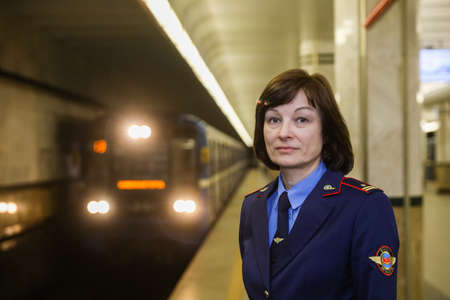 MINSK, BELARUS - 1 MARCH, 2020: Metro worker in uniform is on duty at the stationのeditorial素材