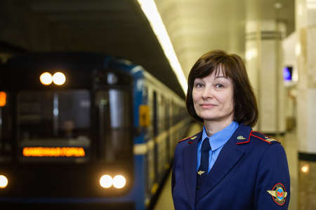 MINSK, BELARUS - 1 MARCH, 2020: Metro worker in uniform is on duty at the stationのeditorial素材