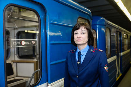 MINSK, BELARUS - 1 MARCH, 2020: Metro worker in uniform is on duty at the stationのeditorial素材