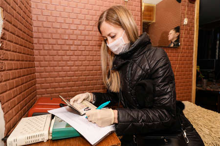 MINSK, BELARUS - 1 MARCH, 2020: red cross volunteer helps an elderly person during coronavirusのeditorial素材