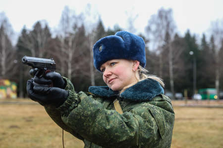 MINSK, BELARUS - 1 MARCH, 2020: woman soldier with gunのeditorial素材