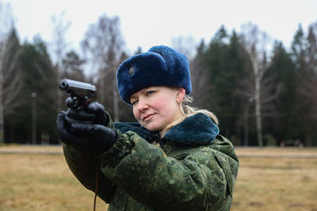 MINSK, BELARUS - 1 MARCH, 2020: woman soldier with gunのeditorial素材