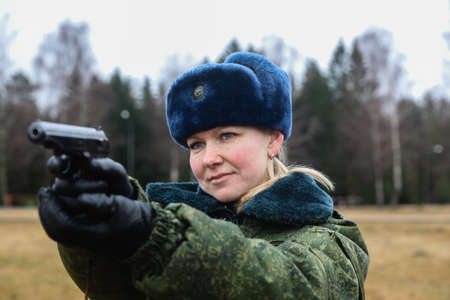MINSK, BELARUS - 1 MARCH, 2020: woman soldier with gunのeditorial素材