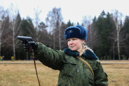 MINSK, BELARUS - 1 MARCH, 2020: woman soldier with gunのeditorial素材