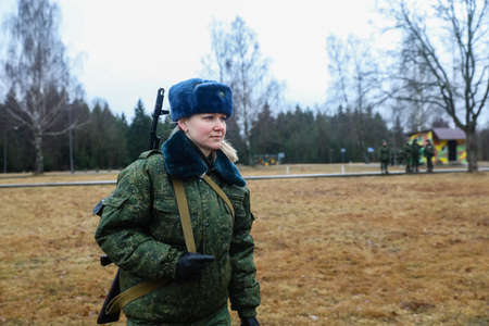MINSK, BELARUS - 1 MARCH, 2020: woman soldier with gunのeditorial素材