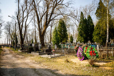 MINSK, BELARUS - 1 MAY, 2019: abandoned Orthodox cemetery in sunny spring weatherのeditorial素材