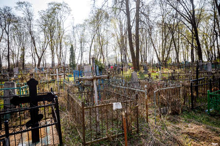 MINSK, BELARUS - 1 MAY, 2019: abandoned Orthodox cemetery in sunny spring weatherのeditorial素材