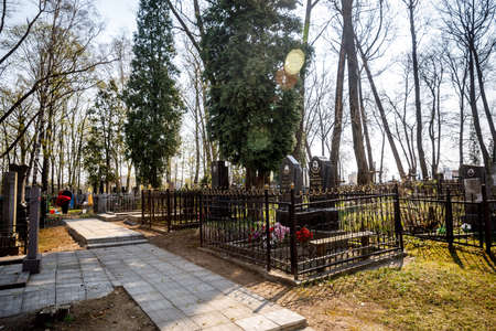 MINSK, BELARUS - 1 MAY, 2019: abandoned Orthodox cemetery in sunny spring weatherのeditorial素材
