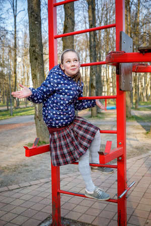 MINSK, BELARUS - 1 MAY, 2019: children, adults and old people exercise on outdoor exercise machinesのeditorial素材