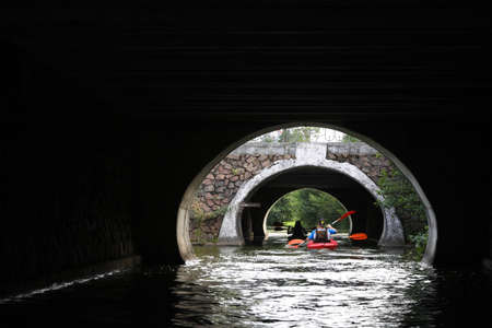 MINSK, BELARUS - 9 AUGUST, 2020: people kayak on the river in the city center in sunny weatherの写真素材