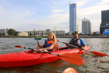 MINSK, BELARUS - 9 AUGUST, 2020: people kayak on the river in the city center in sunny weatherのeditorial素材