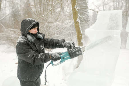MINSK, BELARUS - 1 March, 2022: artist creates ice sculptureのeditorial素材