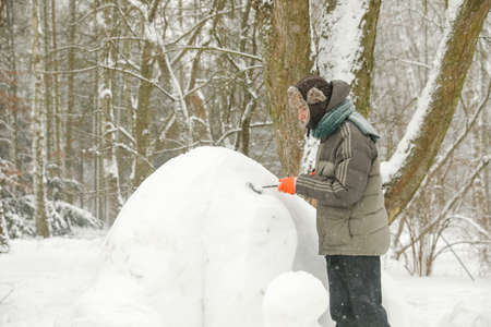 MINSK, BELARUS - 1 March, 2022: artist creates ice sculptureのeditorial素材