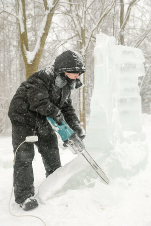 MINSK, BELARUS - 1 March, 2022: artist creates ice sculptureのeditorial素材