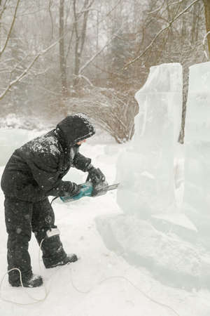 MINSK, BELARUS - 1 March, 2022: artist creates ice sculpture