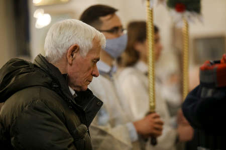 MINSK, BELARUS - 1 March, 2022: Orthodox believers pray in churchのeditorial素材