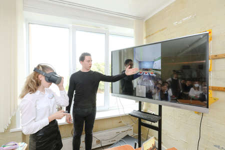 MINSK, BELARUS - 1 March, 2022- schoolchildren use vr at the lessonのeditorial素材