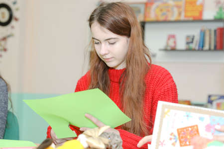 MINSK, BELARUS - 1 March, 2022: schoolgirls do needleworkのeditorial素材