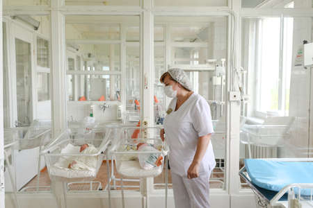 MINSK, BELARUS - FEBRUARY 18, 2022: doctor mum baby maternity hospitalの写真素材