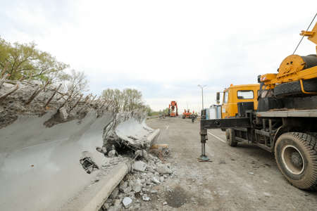 MINSK, BELARUS - 18 FEBRUARY, 2022: workers dismantle and repair the bridgeの写真素材
