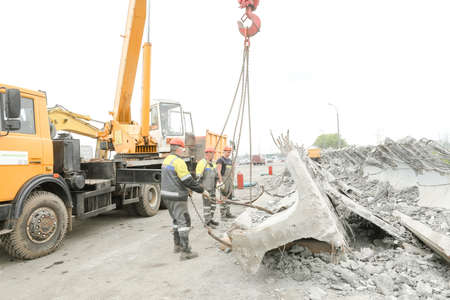 MINSK, BELARUS - 18 FEBRUARY, 2022: workers dismantle and repair the bridgeの写真素材