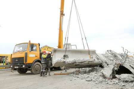MINSK, BELARUS - 18 FEBRUARY, 2022: workers dismantle and repair the bridgeの写真素材
