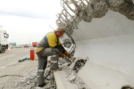 MINSK, BELARUS - 18 FEBRUARY, 2022: workers dismantle and repair the bridgeの写真素材