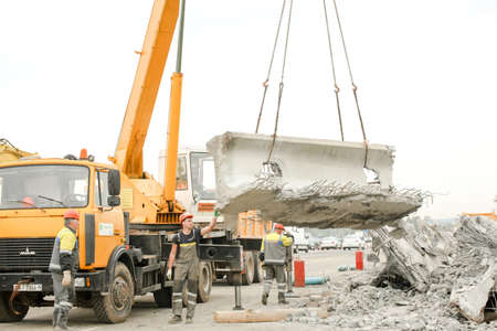 MINSK, BELARUS - 18 FEBRUARY, 2022: workers dismantle and repair the bridgeの写真素材