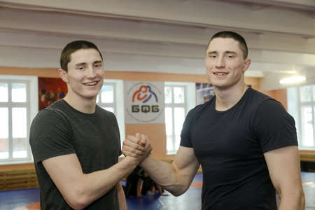 MINSK, BELARUS - 18 FEBRUARY, 2022: twin athletes in the wrestling room