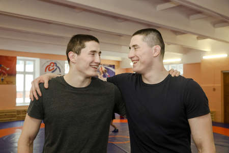 MINSK, BELARUS - 18 FEBRUARY, 2022: twin athletes in the wrestling roomのeditorial素材