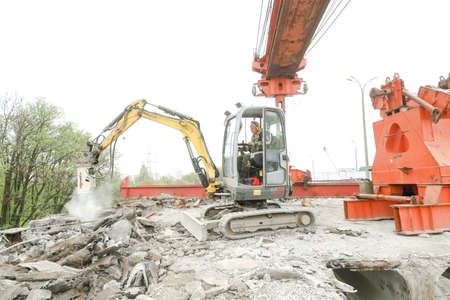 MINSK, BELARUS - 18 FEBRUARY, 2022: workers dismantle and repair the bridgeのeditorial素材