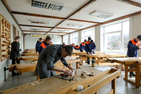 MINSK, BELARUS - 18 FEBRUARY, 2022: young people study in the college of the working professionのeditorial素材