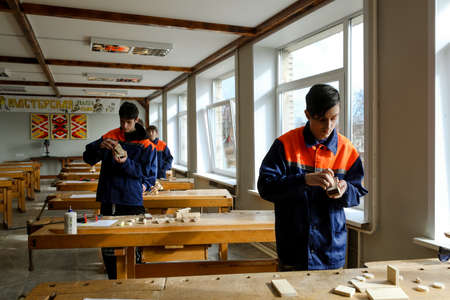 MINSK, BELARUS - 18 FEBRUARY, 2022: young people study in the college of the working professionのeditorial素材