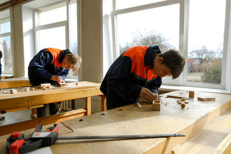 MINSK, BELARUS - 18 FEBRUARY, 2022: young people study in the college of the working professionのeditorial素材