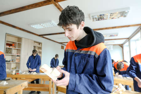 MINSK, BELARUS - 18 FEBRUARY, 2022: young people study in the college of the working professionのeditorial素材