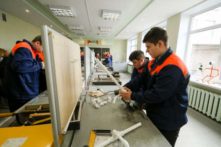MINSK, BELARUS - 18 FEBRUARY, 2022: young people study in the college of the working professionのeditorial素材