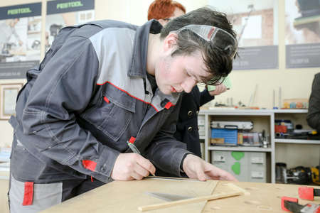 MINSK, BELARUS - 18 FEBRUARY, 2022: young people study in the college of the working professionのeditorial素材